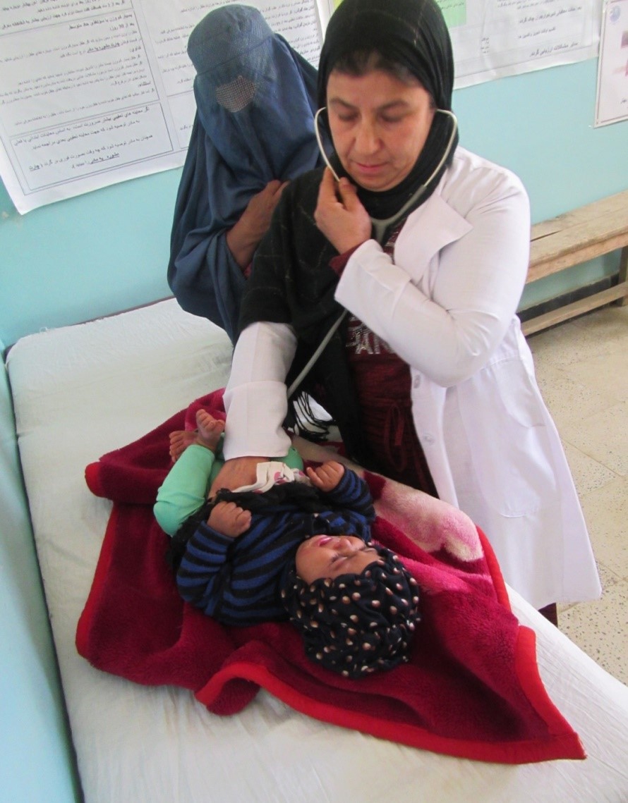 Afghanistan has the highest infant mortality rate in the world. A female doctor examining a baby in our BirthAid Clinic.