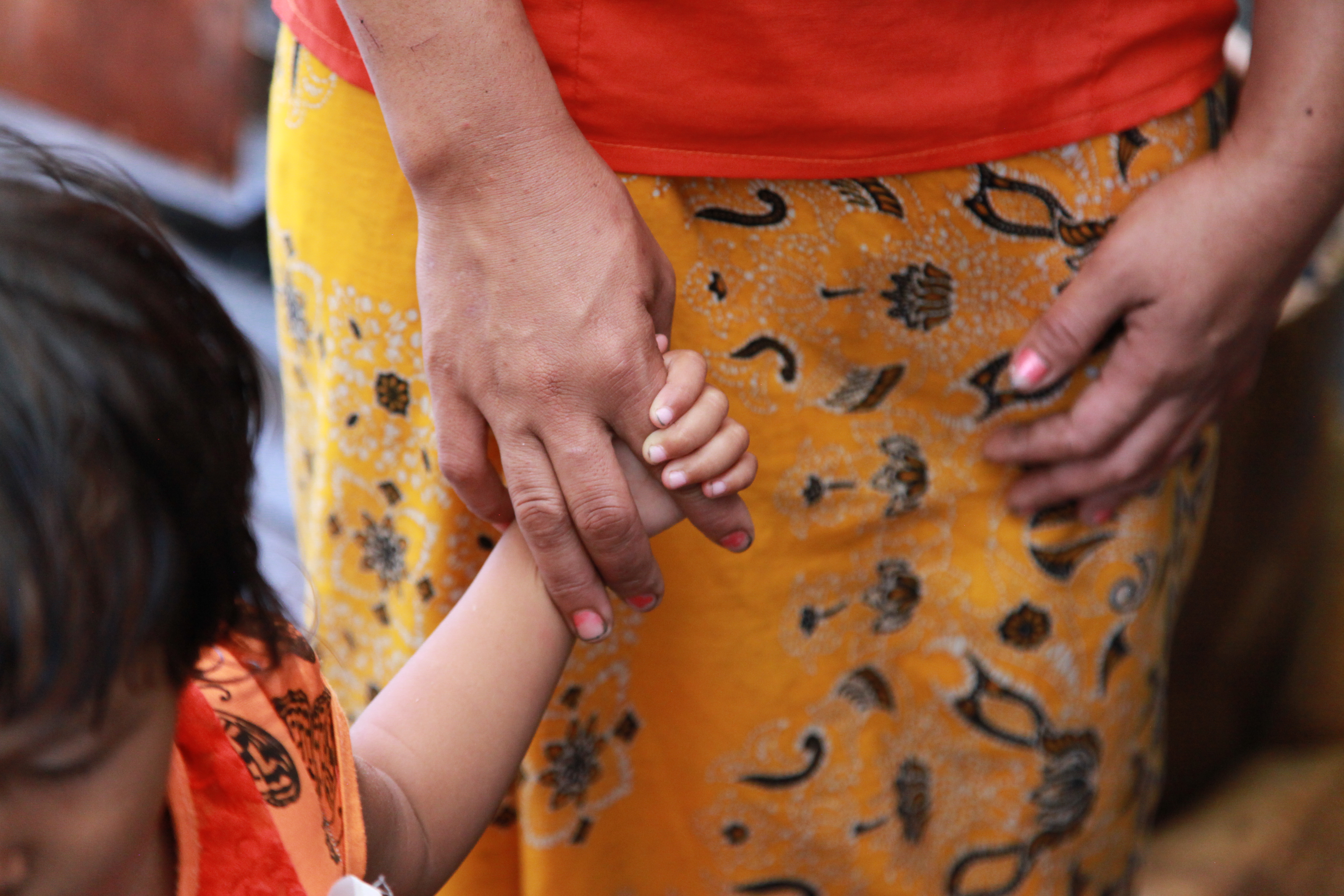NightCare Team Trip - baby holding his mother's hand