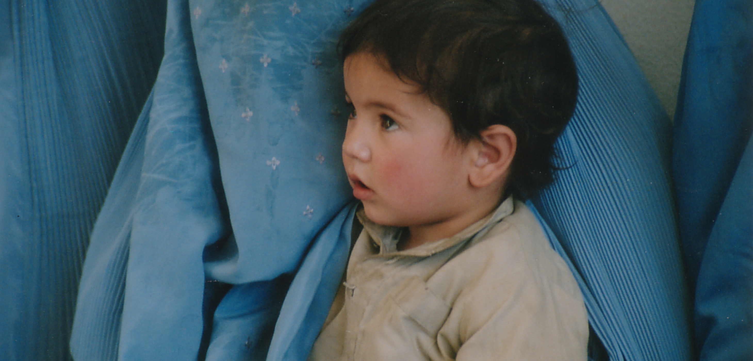 Little boy with his mother at a Saving Moses BirthAid clinic n Afghanistan.