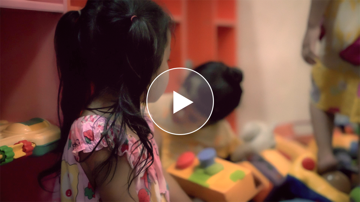 Children playing with colorful toys in a safe environment, highlighting the importance of creating safe spaces for vulnerable children in Southeast Asia.